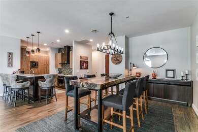 Dining area with a notable chandelier, sink, and w