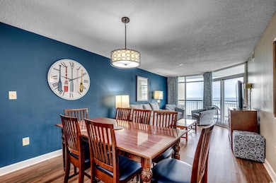 Dining area with a textured ceiling, wood finished