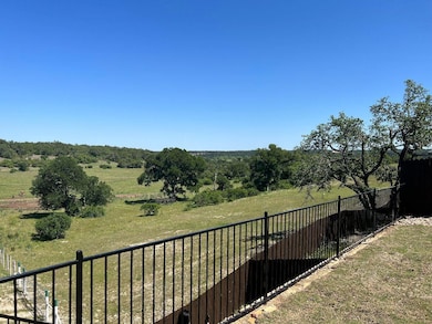 Fenced backyard featuring a view of rural / pastoral area