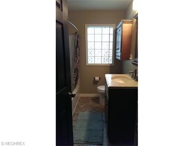 The bathroom was updated in 2013 with new tile and