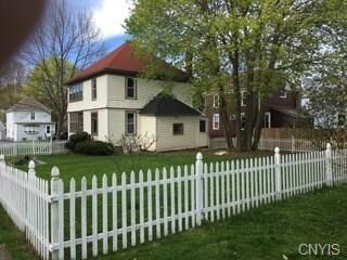 The picket fence adds charm to the property.