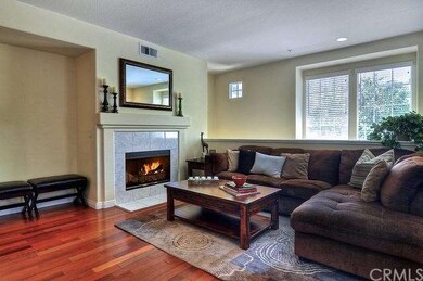 Living room with fireplace and Brazilian hard wood