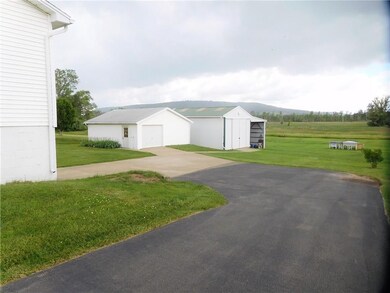 View of outbuildings and beautiful hills in the ba