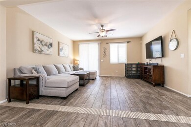 Great room with ceiling fan and slider to back yar