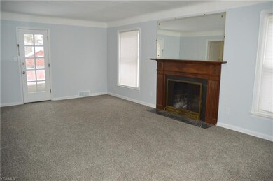 Living Room with Fireplace & mantel.  Door leads t