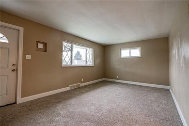 Large window in the living room area allows for th