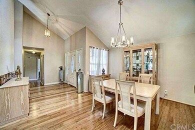 Formal dining space is adjacent to the living room