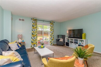 Large living room with sliding glass door to acces