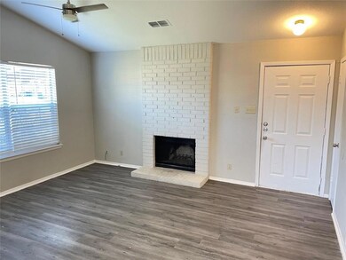 Unfurnished living room featuring lofted ceiling,