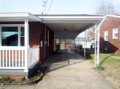 Extra deep attached carport has plenty of room to 