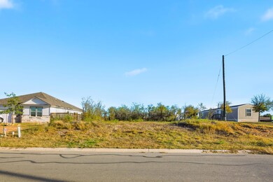 View of asphalt street with curbs