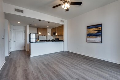 Kitchen featuring kitchen peninsula, stainless ste