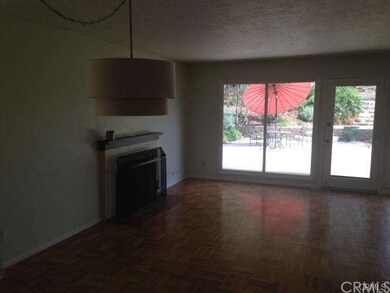 Big  picture  windows and  oak  parquet  flooring 