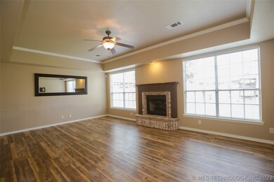 Spacious Family Room with brick fireplace overlook