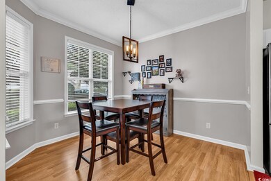 Dining space with an inviting chandelier, light wo