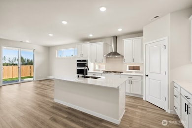 Photos are a completed home of the same floorplan.