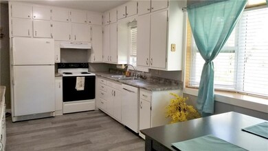 Newer flooring and plenty of counter space too!