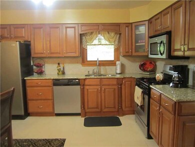 Kitchen. Double bowl stainless sink, corner cabine