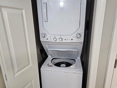 Laundry room with laundry area and stacked washing