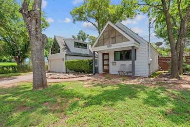 View of front of house featuring concrete drivewa