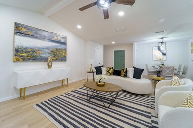 Living room featuring light wood-type flooring, lo