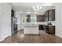 Kitchen featuring freestanding refrigerator, whit