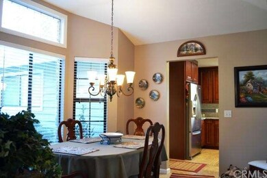 The formal dining room has a coffered ceiling, win