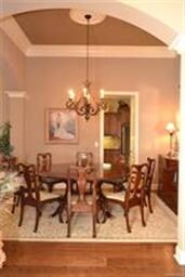 Open to the foyer and greatroom, the dining room c