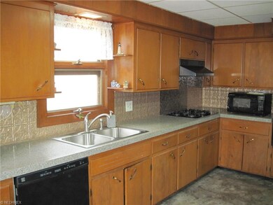 Newly installed granite counter-tops and tile over cook-top.