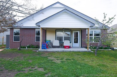 covered patio, dwarf apple tree and garden space i
