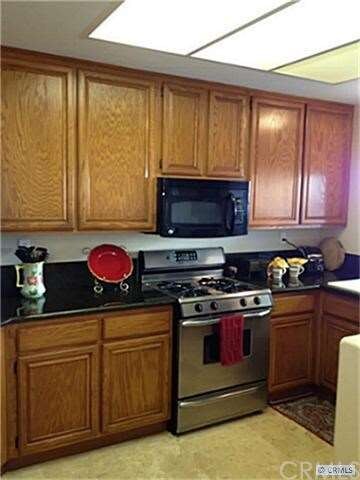 Remodeled Kitchen with granite counters and stainl