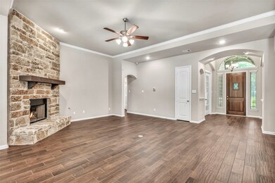 The stone covered fireplace with it's mantle are a beautiful feature in the family room.