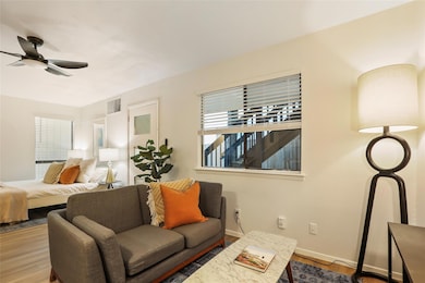 Bedroom featuring wood finished floors, multiple 