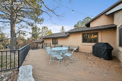Deck with outdoor dining area and grilling area