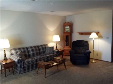 Living room as seen from kitchen dining area. Note