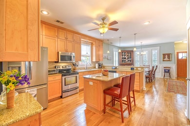 Kitchen featuring plenty of natural light, a penin
