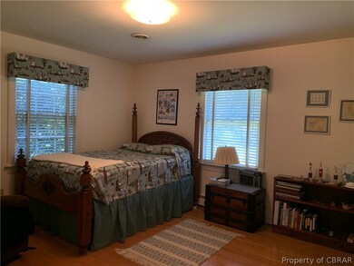 First Master Bedroom with Hardwood Floors