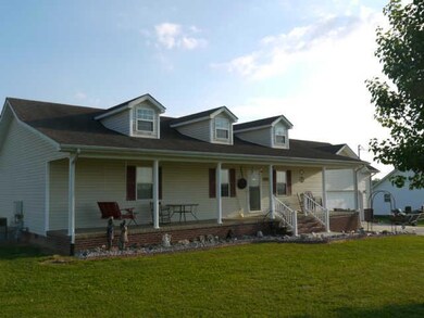 Another view of the home with a large yard sitting on .69 acres 