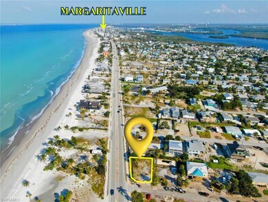 VIRTUALLY ENHANCED - Birds eye view of property with a view of the beach and a water view VIRTUALLY EDITED