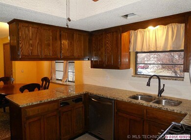 Double stainless steel sink. Plenty of cabinets an