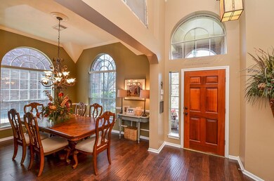 Gleaming wood floors throughout the formal dining.