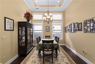 Formal dining room features 14' tray and engineere