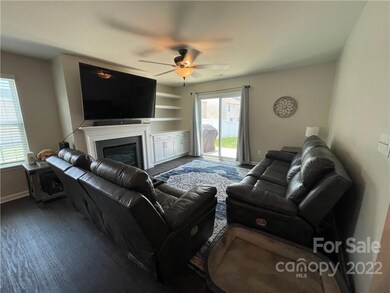 Living Room with built in cabinets and shelves
