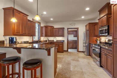 Breakfast bar for ideal entertaining. Refrigerator