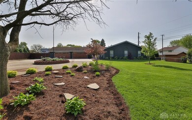The deep front yard adds to the peaceful quiet of