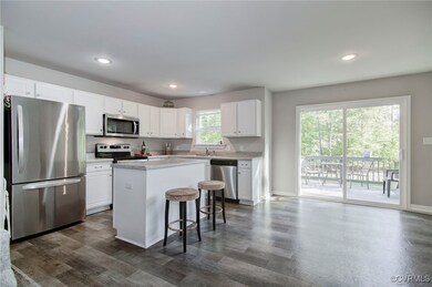 Kitchen with appliances with stainless steel finis