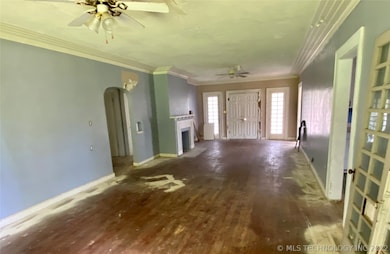 Dining/Living combo. Bedroom 1, Kitchen, Utility and bath to right. Two bedrooms, bath to left.