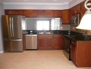 Another view of this lovely L-shaped kitchen.