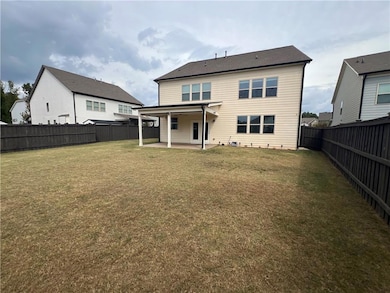 Back of house featuring a patio and a fenced backyard