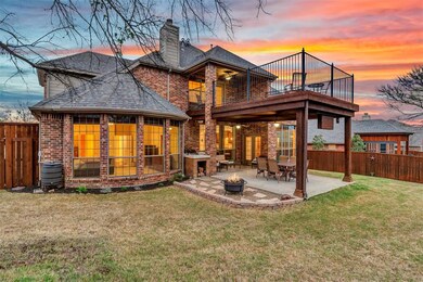 Twilight view of the back of the home.